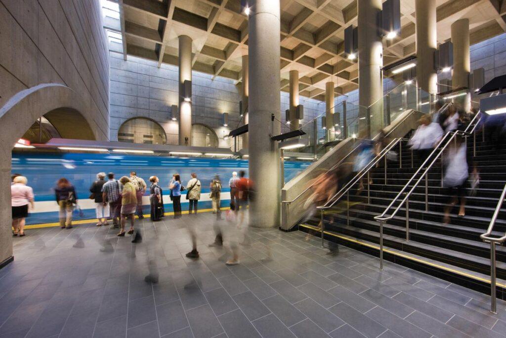 Passengers waiting on Montreal metro platform during November 2025 STM strike with limited service hours